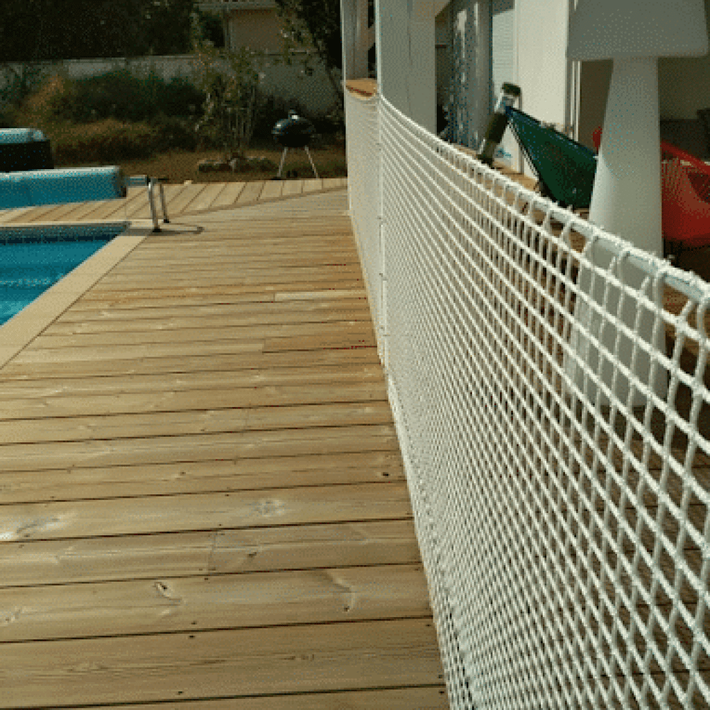 If your balcony railing has slats that are too wide, add plastic chicken  wire. Use twist ties to attach…